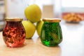 Jam of fir twigs and cones and mountain cranberries in small jars