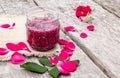 Jam rose petals on a wooden table. Flower confiture. Healthy food