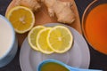 Jam with sea buckthorn juice with ginger and lemon on a wooden background. Conceptual autumn vitamin drink to enhance health and Royalty Free Stock Photo