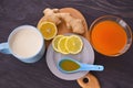 Jam with sea buckthorn juice with ginger and lemon on a wooden background. Conceptual autumn vitamin drink to enhance health and Royalty Free Stock Photo