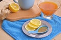 Jam with sea buckthorn juice with ginger and lemon on a wooden background. Conceptual autumn vitamin drink to enhance health and