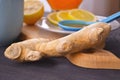 Jam with sea buckthorn juice with ginger and lemon on a wooden background. Conceptual autumn vitamin drink to enhance health and Royalty Free Stock Photo