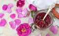 Jam of tea rose petal in glass jar on light marble background. Flower confiture. Healthy food. Copy space Royalty Free Stock Photo