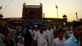 Jama Masjit mosque huge crowd in market near in rays of sunset