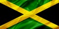 Jamaica country flag on silk or silky waving texture Royalty Free Stock Photo