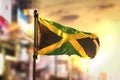 Jamaica Flag Against City Blurred Background At Sunrise Backlight Royalty Free Stock Photo