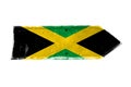Jamaica flag and colors green, yellow and black over arrow shape from a rusty and grunge metal iron plate Royalty Free Stock Photo