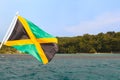 Jamaica flag waving sea beach sky Royalty Free Stock Photo