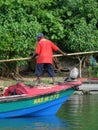 Jamaican fisherman paddling on a boat Royalty Free Stock Photo