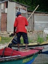 Jamaican fisherman paddling on a boat Royalty Free Stock Photo