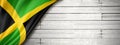 Jamaican flag on old white wall banner Royalty Free Stock Photo