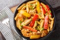 Jamaican Rasta Pasta tossed in Jamaican jerk seasoning, chicken, coconut milk and with colourful sauteed bell peppers closeup on Royalty Free Stock Photo