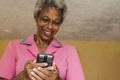 Jamaican Senior Woman Laughing At Comedy Video Royalty Free Stock Photo