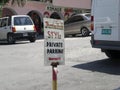 Jamaican Style private parking sign, shopping plaza, West End Road, Negril, Westmoreland, Jamaica Caribbean West Indies