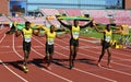 Jamaican 4x100 relay team running with flags after winning silver on the IAAF World U20 Championship in Tampere, Finland