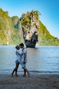 James Bond island near Phuket in Thailand. Famous landmark and famous travel destination, couple men and woman mid age Royalty Free Stock Photo