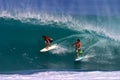 Jamie O'brien and Kalani Chapman Surfing a Wave Royalty Free Stock Photo