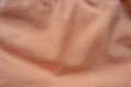 Jammed apricot-colored simple cotton jersey fabric