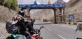 Jammu and Kashmir, India - June 18 2019: A biker posing in front of the signboard of Kargil. Leaving Kargil for Leh, Ladakh