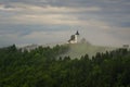 Jamnik church on a hillside in the spring, foggy weather at sunset in Slovenia, Europe. Mountain landscape shortly after spring ra Royalty Free Stock Photo