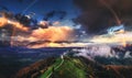 Jamnik, Slovenia - Aerial view of rainbow over the church of St. Primoz in Slovenia near Jamnik with beautiful clouds and Julian Royalty Free Stock Photo