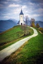 Jamnik, Slovenia - The beautiful church of St. Primoz in Slovenia near Jamnik with Julian Alps Royalty Free Stock Photo