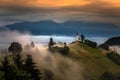 Jamnik, Slovenia - Magical foggy summer morning at Jamnik St.Primoz hilltop church at sunrise with fog