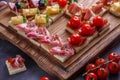 Jamon, ham, sausage and cheese on crusty garlicy bread or pinxtos, spanish cuisine Royalty Free Stock Photo