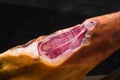 Jamon. Jamon serrano. Traditional Spanish ham on black close up. Royalty Free Stock Photo