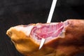 Jamon. Jamon serrano. Traditional Spanish ham on black close up. Royalty Free Stock Photo