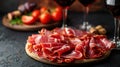 jamon with red wine on a black background Royalty Free Stock Photo