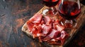 jamon with red wine on a black background Royalty Free Stock Photo