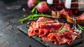 jamon with red wine on a black background Royalty Free Stock Photo