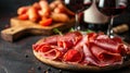 jamon with red wine on a black background Royalty Free Stock Photo