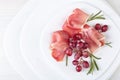 Jamon serrano with rosemary and grape . Royalty Free Stock Photo