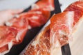 Jamon serrano. Traditional Spanish ham, Slicing of dry-cured ham in Spain Royalty Free Stock Photo