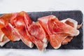 Jamon serrano. Traditional Spanish ham, Slicing of dry-cured ham in Spain Royalty Free Stock Photo