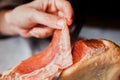 Jamon serrano. Traditional Spanish ham, Slicing of dry-cured ham in Spain Royalty Free Stock Photo