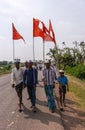 Red flags in front of pilgrims marching, Jamunai, Karnataka, India