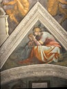 Close-up photo of Ancestors Of Christ-Solomon The Father Of Rehoboam ceiling fresco painting by Michelangelo