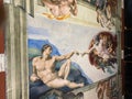 Close-up photo of The Creation of Adam ceiling fresco painting by Michelangelo in the Sistine Chapel Royalty Free Stock Photo