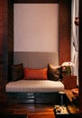 JAN 8, 2013 Bangkok, Thailand - Tropical Thai spa room with wooden furniture, couch, foot bath, colourful silk pillow.