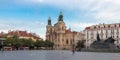 Jan Hus monument and the St. Nicholas` Church in Prague Royalty Free Stock Photo