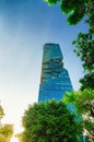 Jan 4, 2020 - King Power Mahanakhon high-rise in lush foliage and sunlight, Bangkok, Thailand