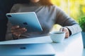 Jan 5th 2021 : A woman using Apple New Ipad Pro 2020 digital tablet with Apple MacBook Pro laptop computer while Royalty Free Stock Photo