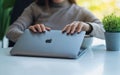 Jan 5th 2021 : A woman opening a laptop computer, getting ready for work in office, Chiang mai Thailand