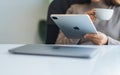 Jan 5th 2021 : A woman using Apple New Ipad Pro 2020 digital tablet with Apple MacBook Pro laptop computer on the Royalty Free Stock Photo