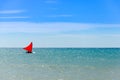 Jangada boat on the green sea water