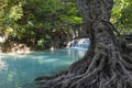 Jangle landscape with flowing turquoise water of Erawan cascade waterfall Royalty Free Stock Photo