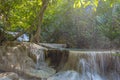 Jangle landscape with flowing turquoise water of Erawan cascade waterfall Royalty Free Stock Photo